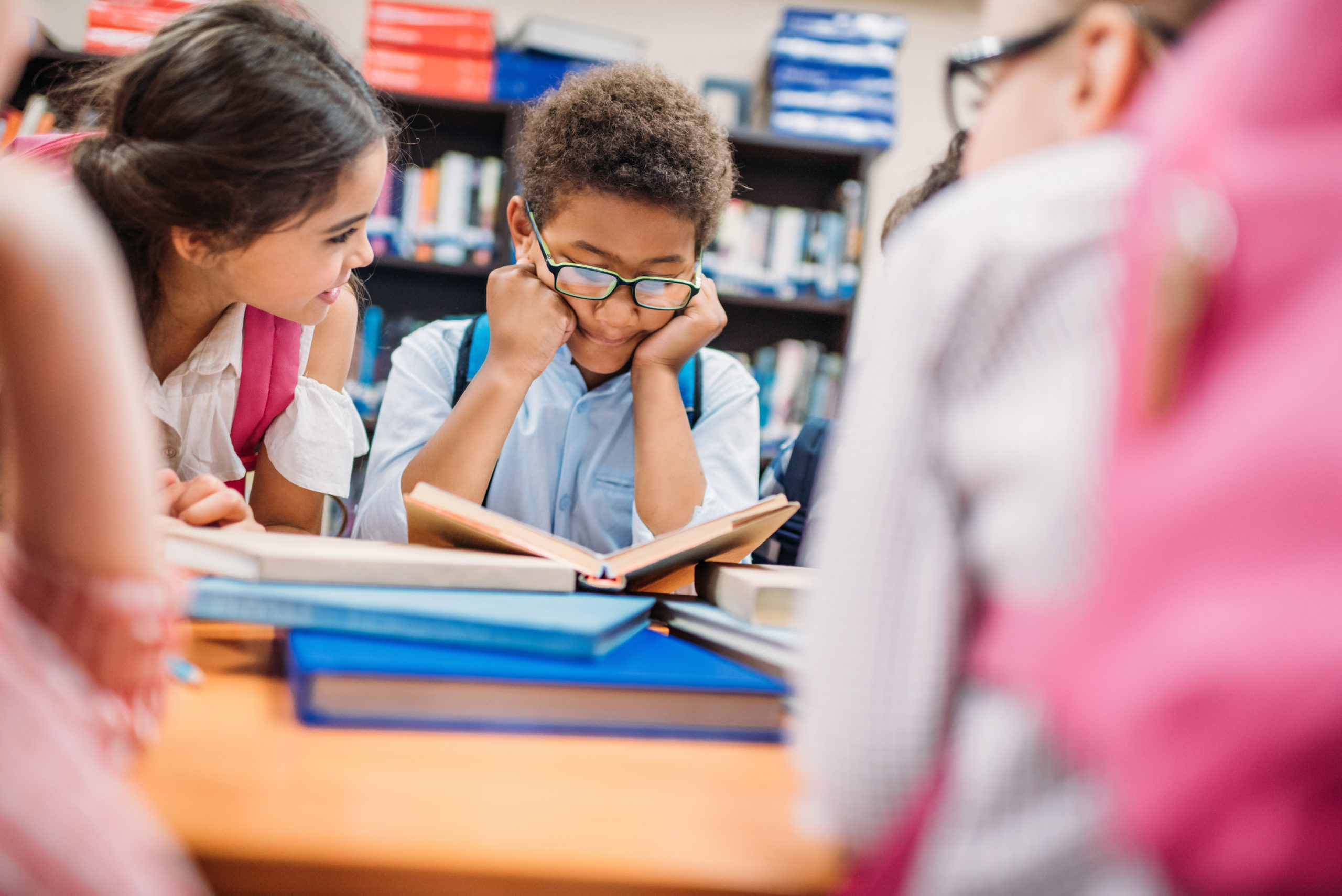 adorable little kids in school library