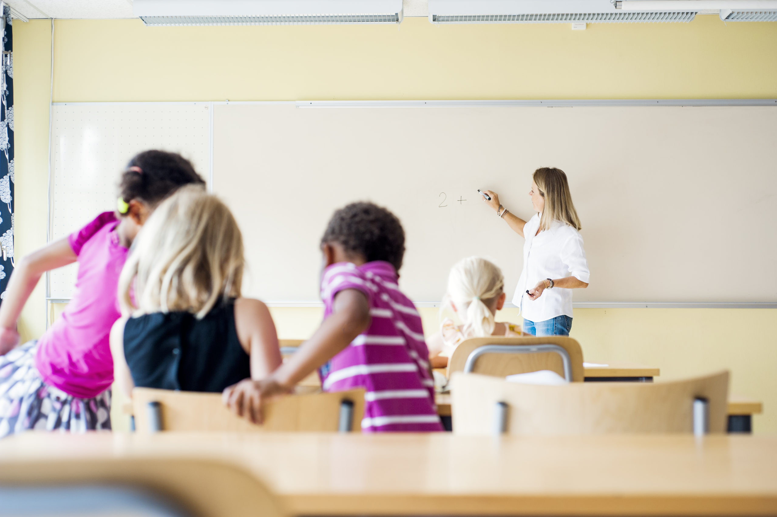 Teacher and children in math class